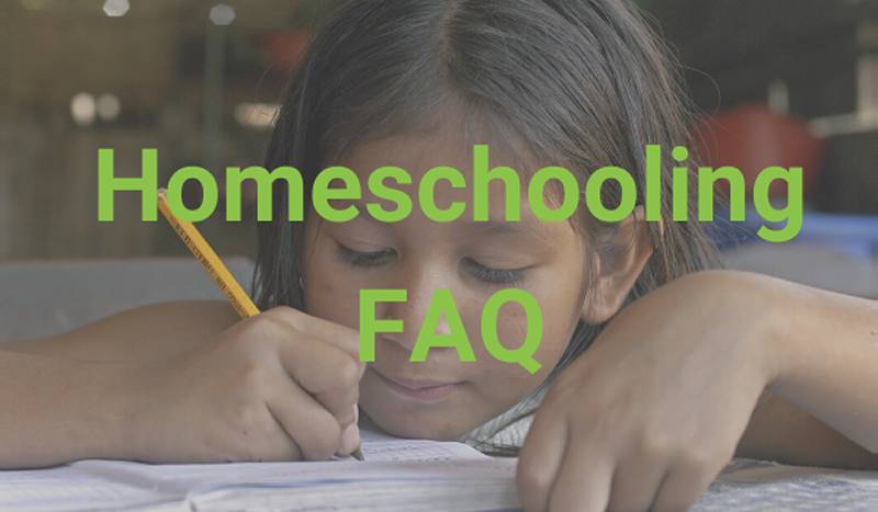 Homeschooling FAQ. Girl sitting at paper, holding pencil and writing on a piece of paper.
